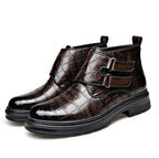 Pair of croc-embossed ankle boots standing together