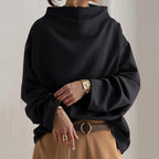 Black high neck knit top for women, front view of the relaxed fit