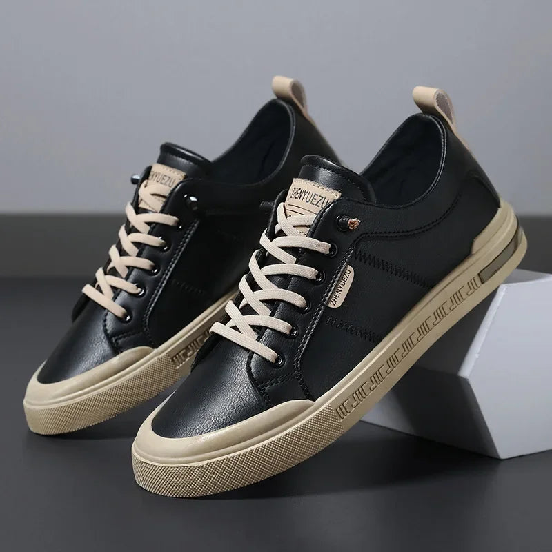 Men's leather sneakers in black and beige, side profile of the pair