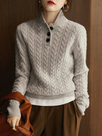 Cable knit cashmere sweater for women, detail of the button-up funnel neck collar