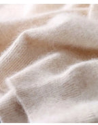 Men's cashmere t-shirt worn under an open jacket, styling shot