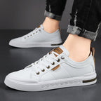 Men's leather sneakers, close-up of the flat rubber sole and lace-up front