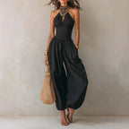 Black halter neck wide leg jumpsuit for women, full-length front view