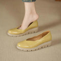 Genuine leather ballet flats for women in yellow, side view showing the rounded toe