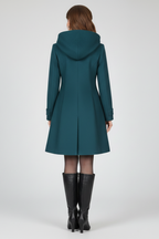 Hooded coat for women, detail of a flap hip pocket and long sleeve cuff