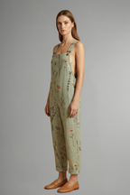 Side view of the wide leg jumpsuit showing the drape through the leg
