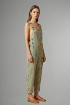 Full length view of the printed green wide leg jumpsuit