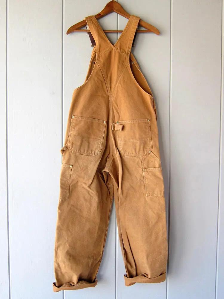 Close up of the adjustable strap buckle on the overalls