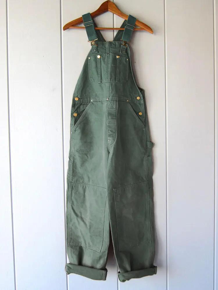 Green wide leg overalls styled on a model, full length