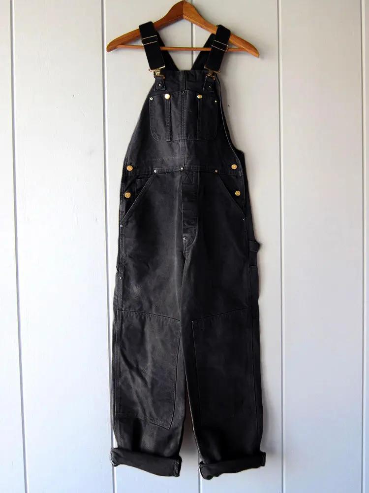 Black wide leg overalls shown from the front
