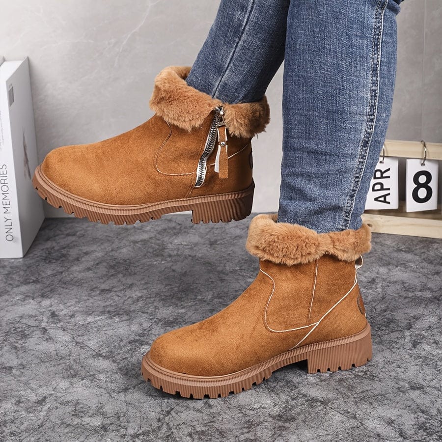 Lug sole ankle boots for women worn with straight-leg jeans, full-length styling shot