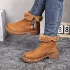 Lug sole ankle boots for women worn with straight-leg jeans, full-length styling shot