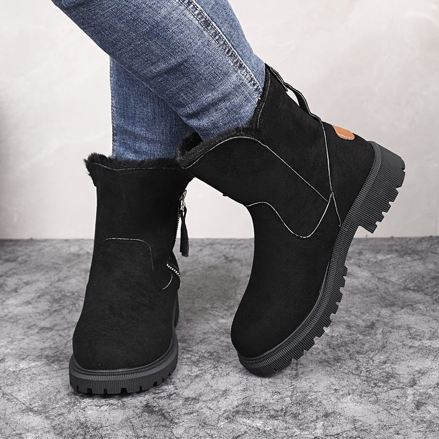 Close view of the deep lug tread on the sole of the ankle boots