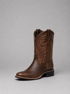Brown embroidered western boot, single shoe photographed against a plain backdrop