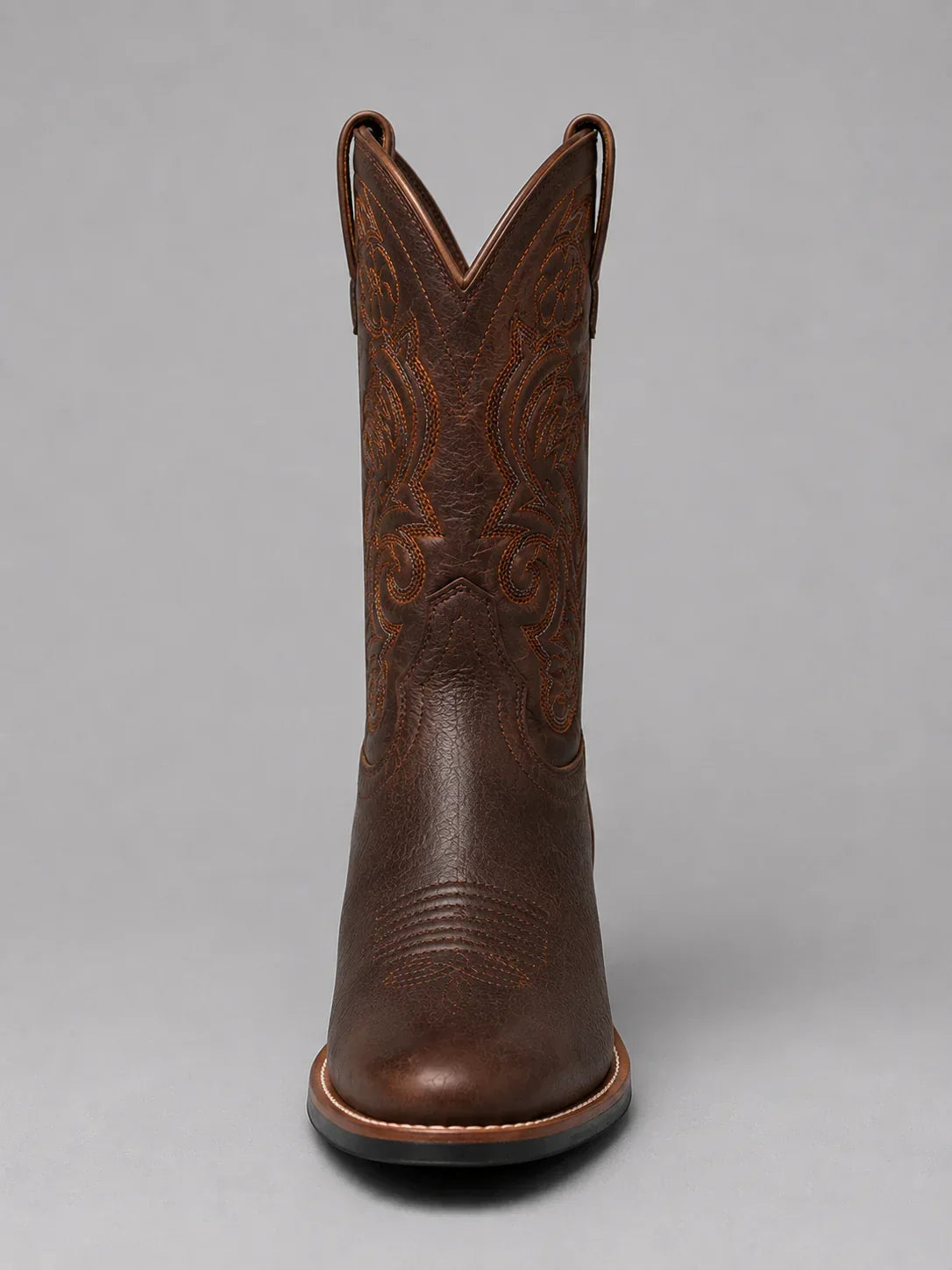 Brown embroidered western boot, close range on the upper and stitching