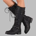 Black knee high lace up combat boots for women with buckle straps, side view