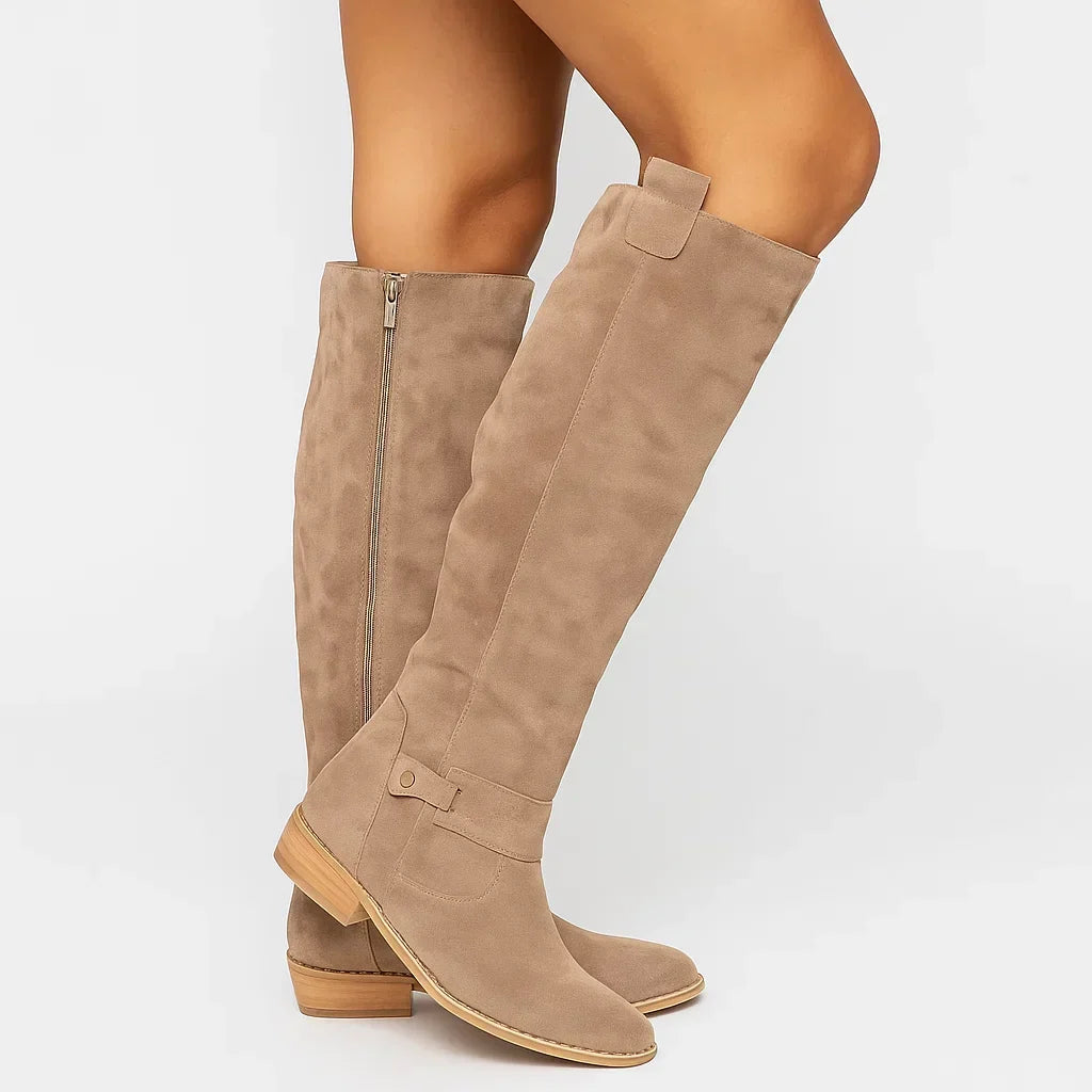 Beige suede boot standing upright, shaft rising to just under the knee
