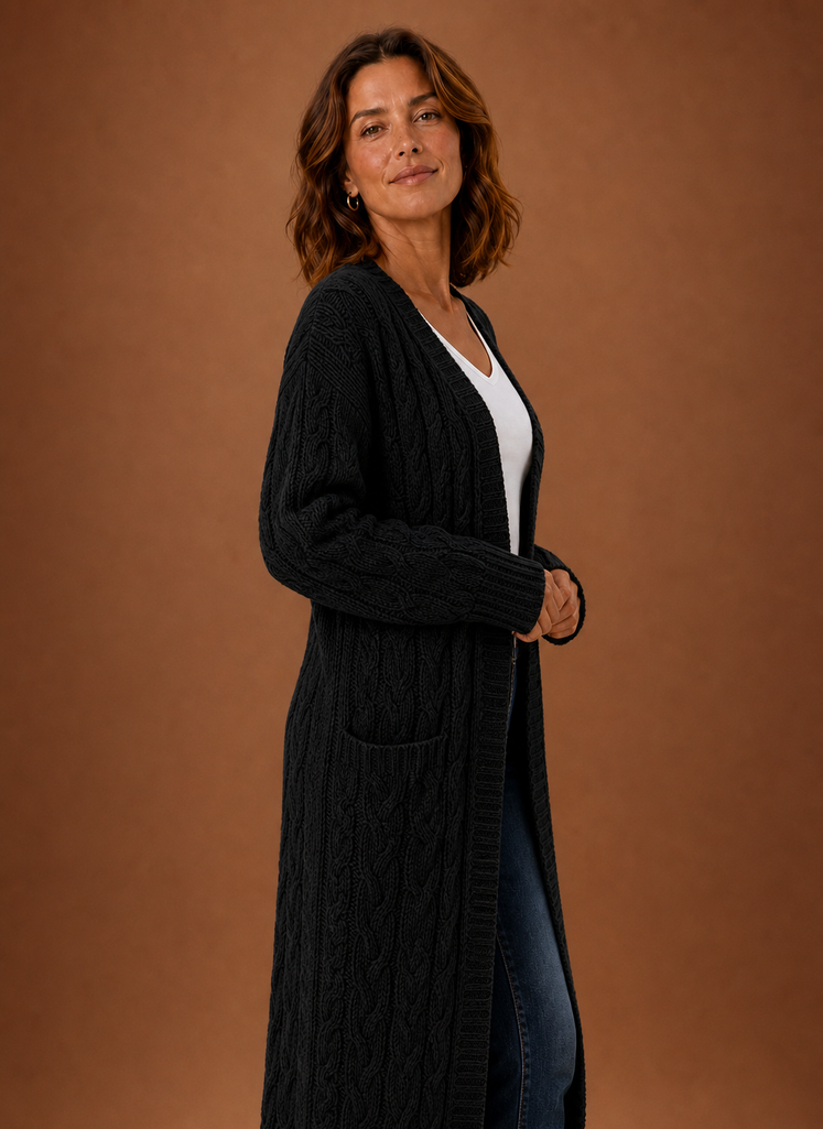 Black cardigan turned sideways, hem falling below the hipline