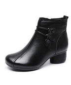 Close-up of the leaf accents and square toe on the chunky heel boots