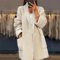 Beige open front knit cardigan with collar and pockets