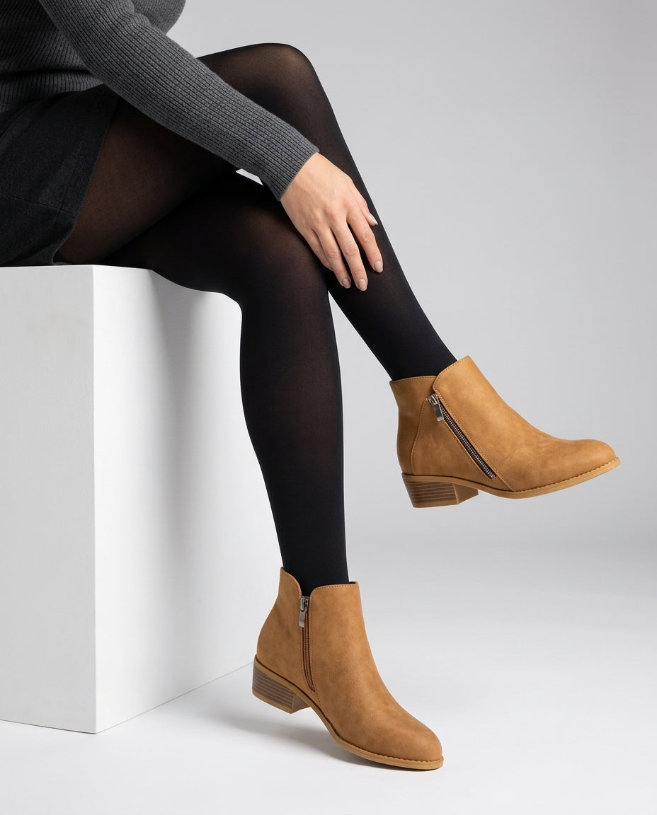 Block heel ankle boot in Brown, shown against a plain studio background