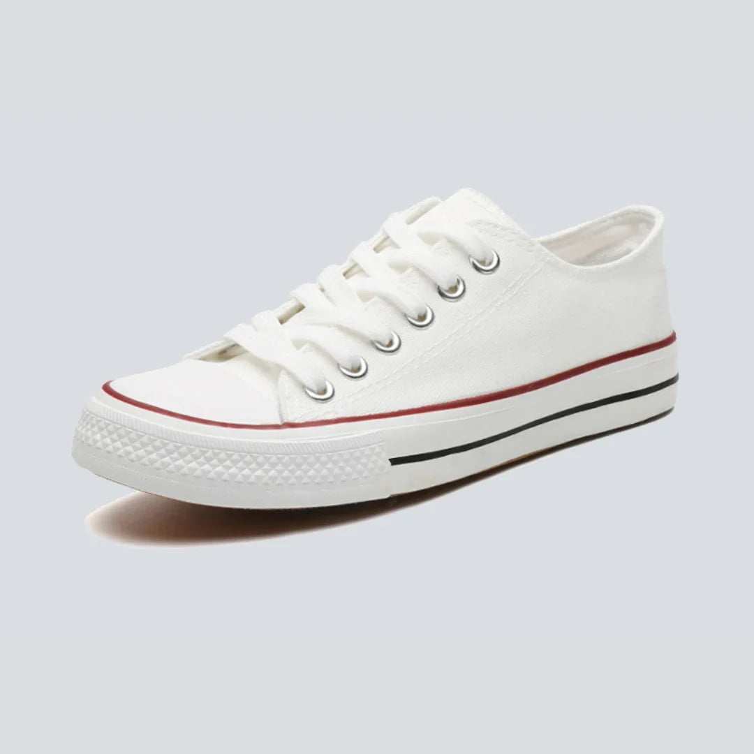 Canvas sneakers for women in white and red, side view of the reinforced round toe cap