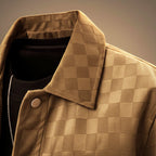 Close-up of the point collar and button front on the plaid suede shirt jacket