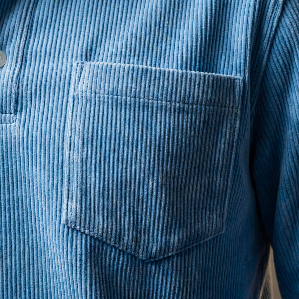 Men's corduroy long sleeve polo shirt — side profile view