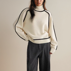 Cashmere turtleneck sweater, side view showing the loose fit through the body