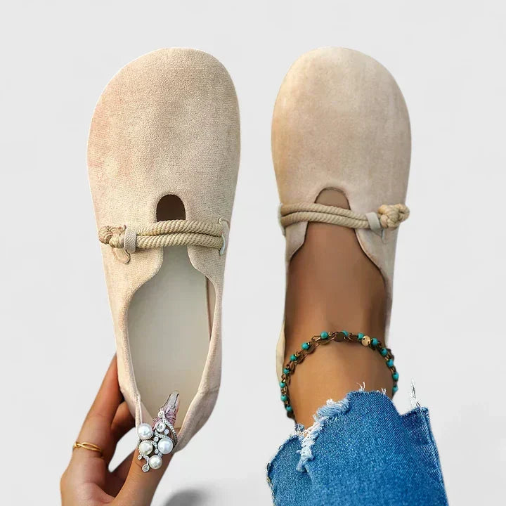 Beige ergonomic loafers photographed as a pair