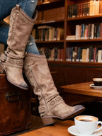 Buckle straps set at the ankle and higher on the shaft