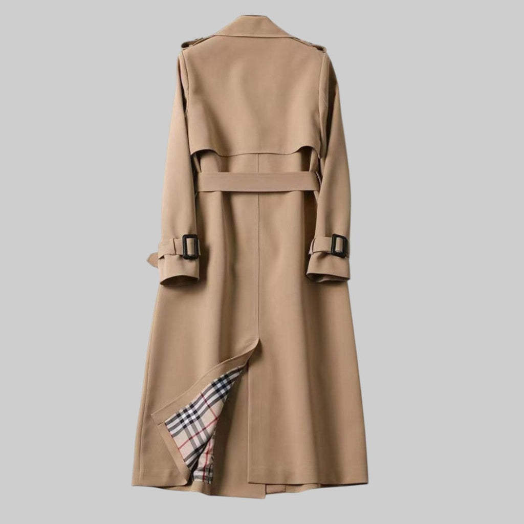 Detail of a buckled cuff strap and the plaid lining at the edge