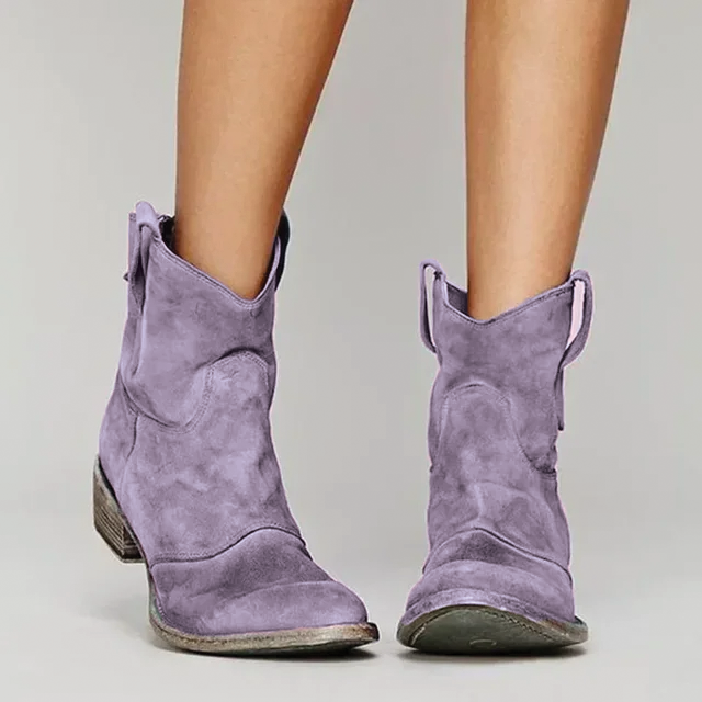 Lavender nubuck ankle boots on a light surface