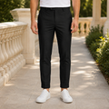 Black tailored pants for men, front view of the slim tapered leg