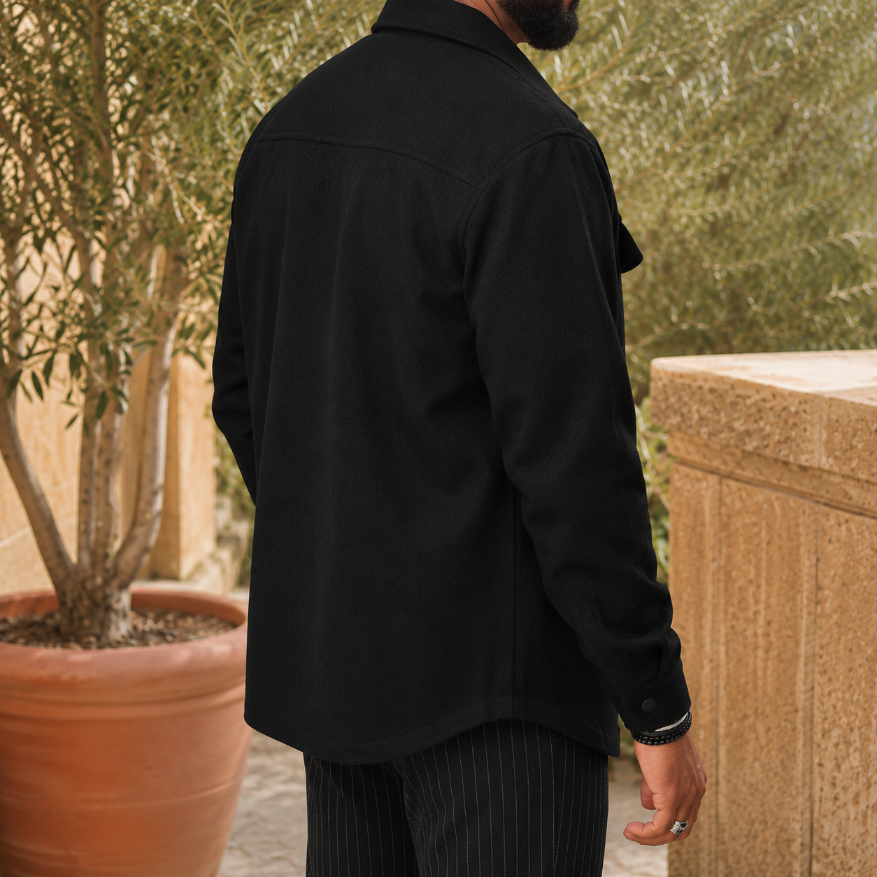 Snap front and twin flap chest pockets on the men's utility jacket