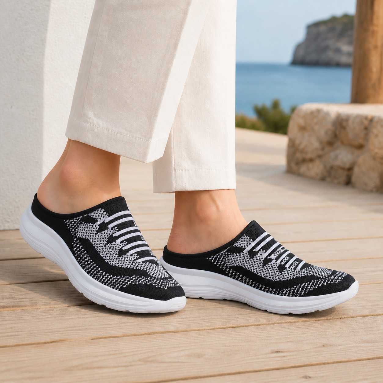Black mesh knit slip on sneakers for women, side view
