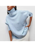 Oversized turtleneck sweater in Blue, shown against a plain studio background