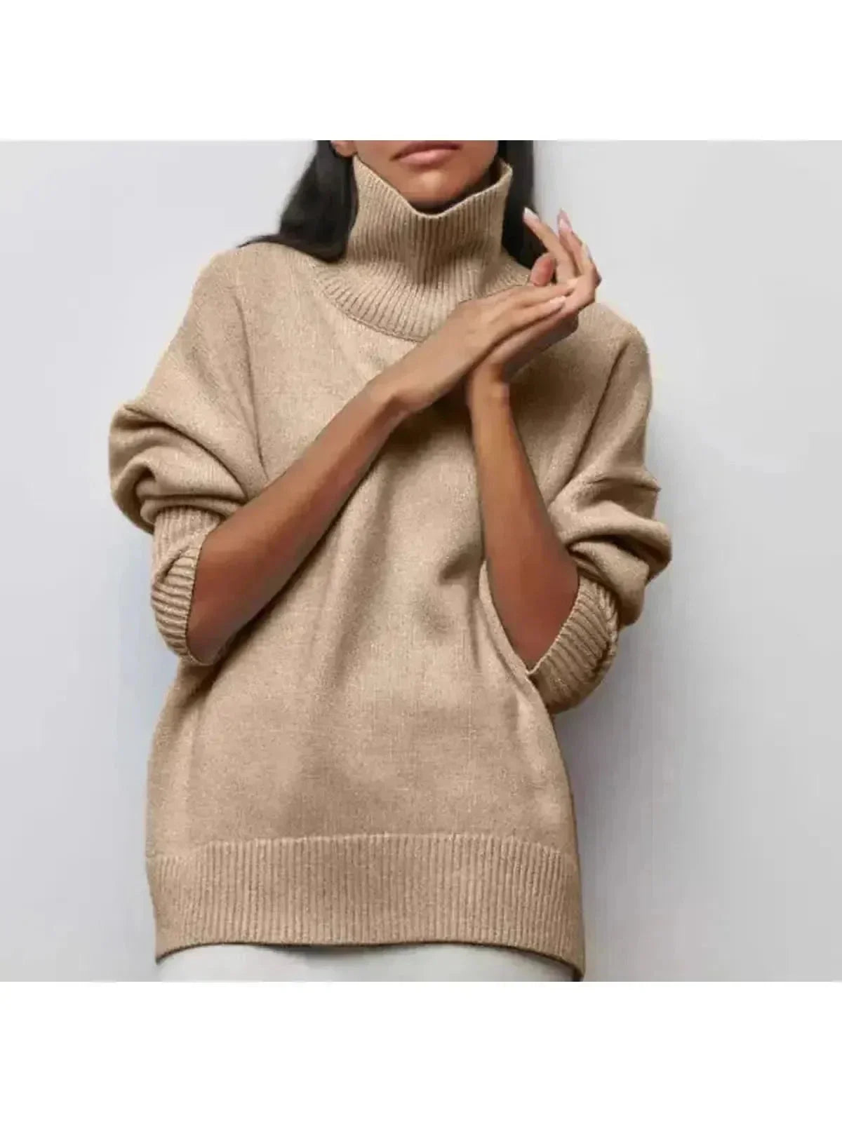 Oversized turtleneck sweater in Beige, shown against a plain studio background