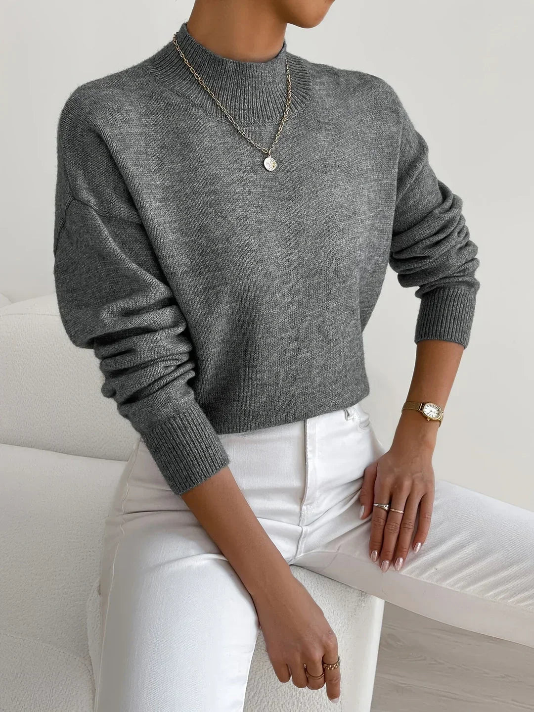 Turtleneck sweater for women in dark gray, shown layered under a blazer