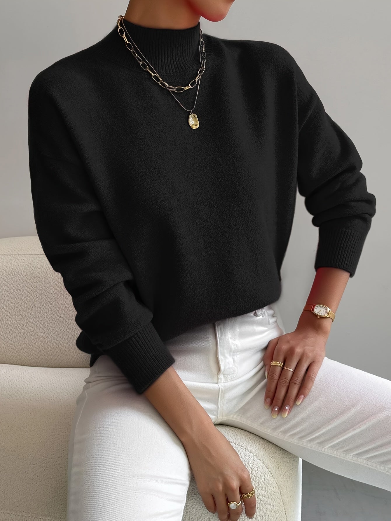 Turtleneck sweater for women in black, showing the close skimming fit