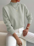 Turtleneck sweater for women in light green, showing the full folded collar
