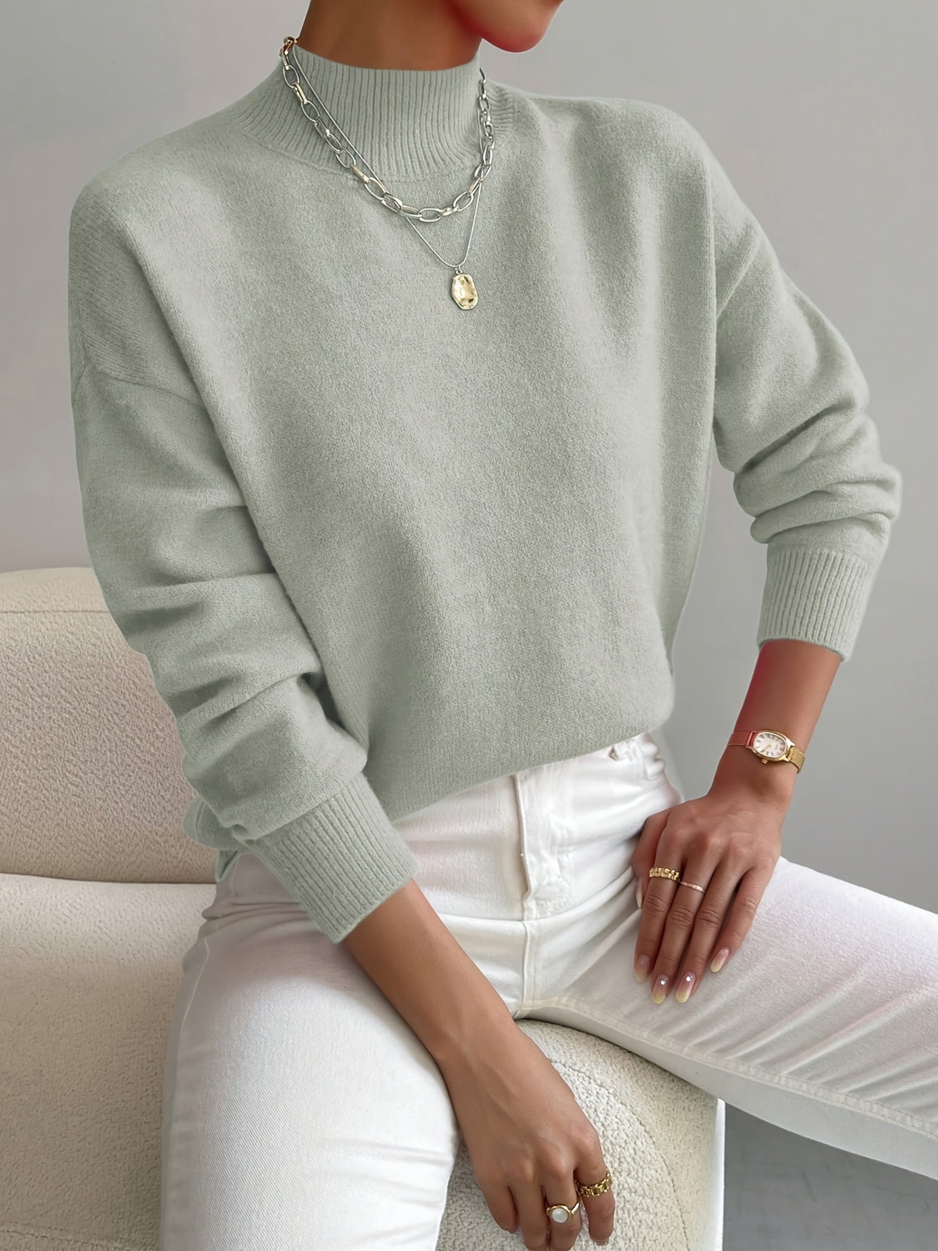 Turtleneck sweater for women in light green, showing the full folded collar
