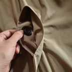 Three-quarter angle on the coat's relaxed-fit body