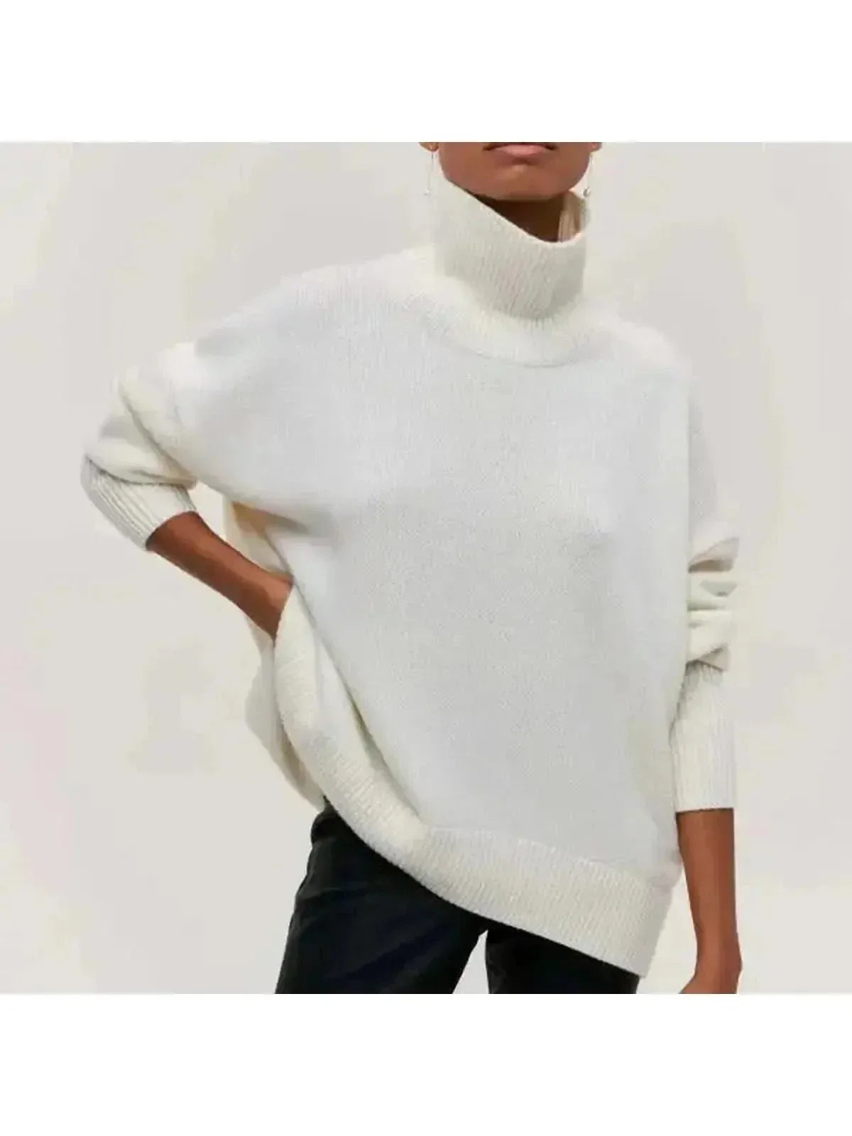 Oversized turtleneck sweater in White, shown against a plain studio background