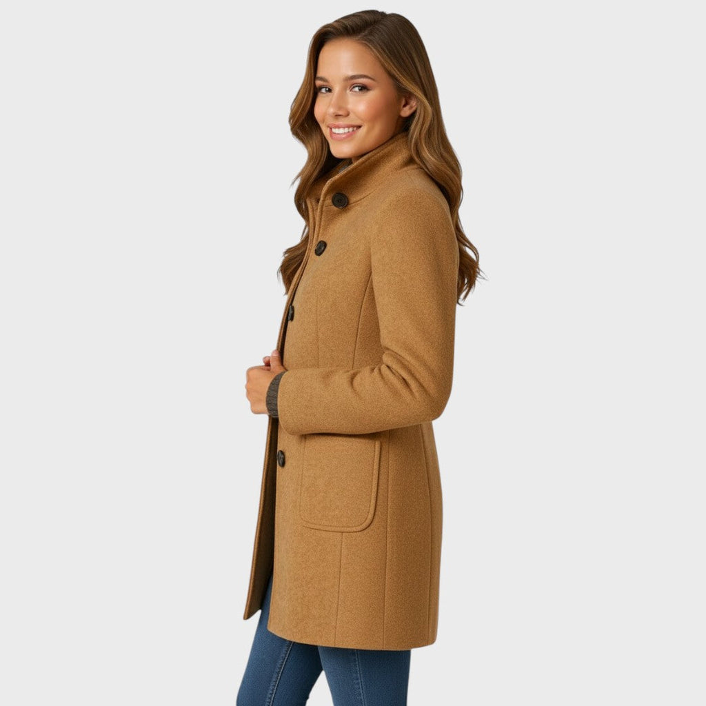 Full-length styling shot of the funnel-neck long coat