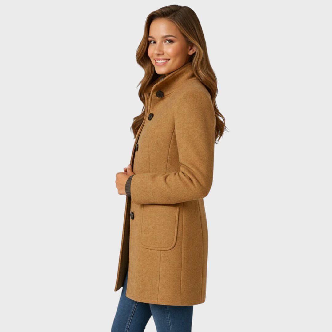 Full-length styling shot of the funnel-neck long coat
