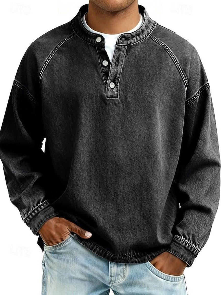 Men's long sleeve henley in black, showing the washed mottled finish