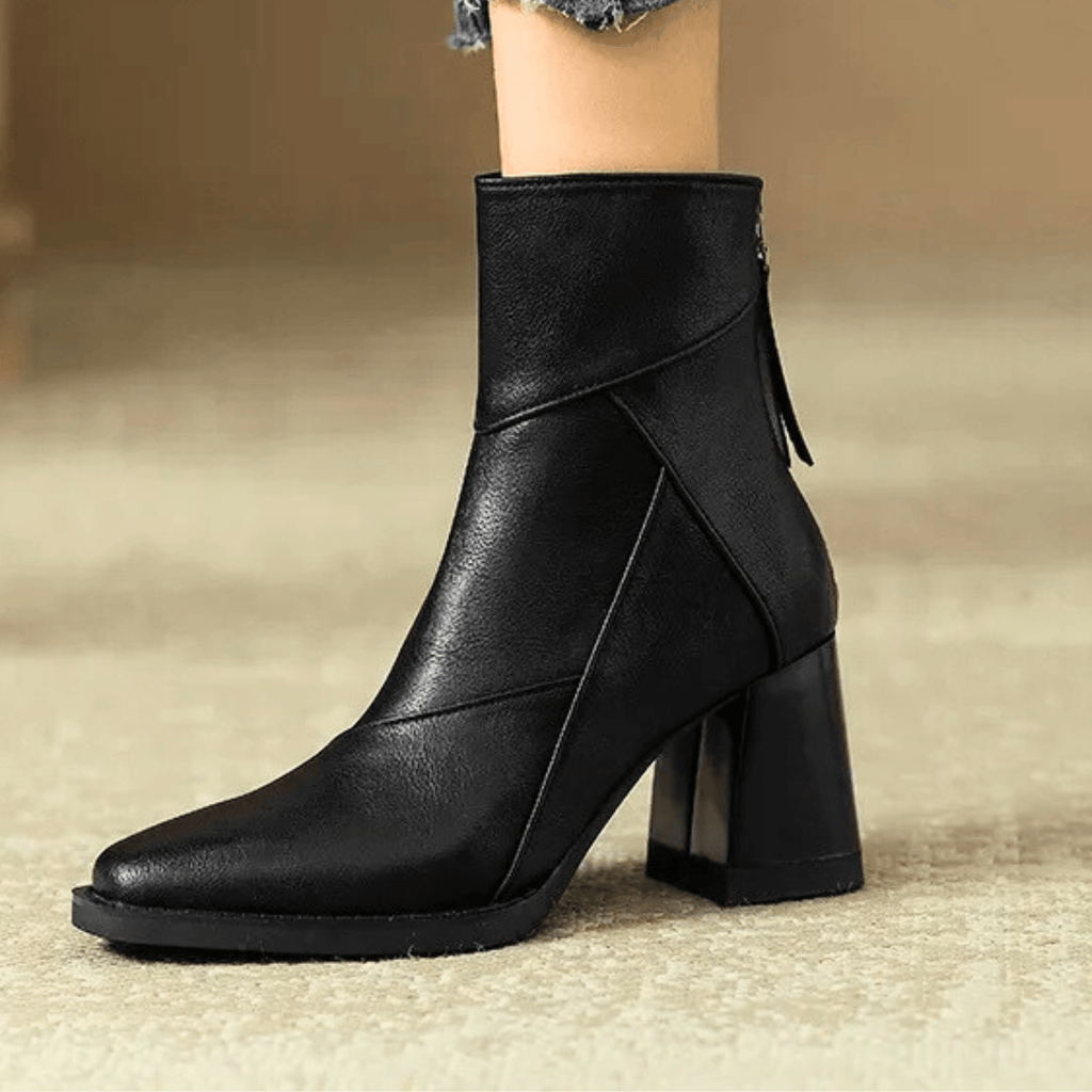 Leather block heel ankle boots — close view of the sole and heel