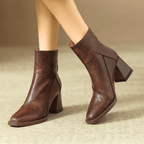 Leather block heel ankle boots — close view of the upper