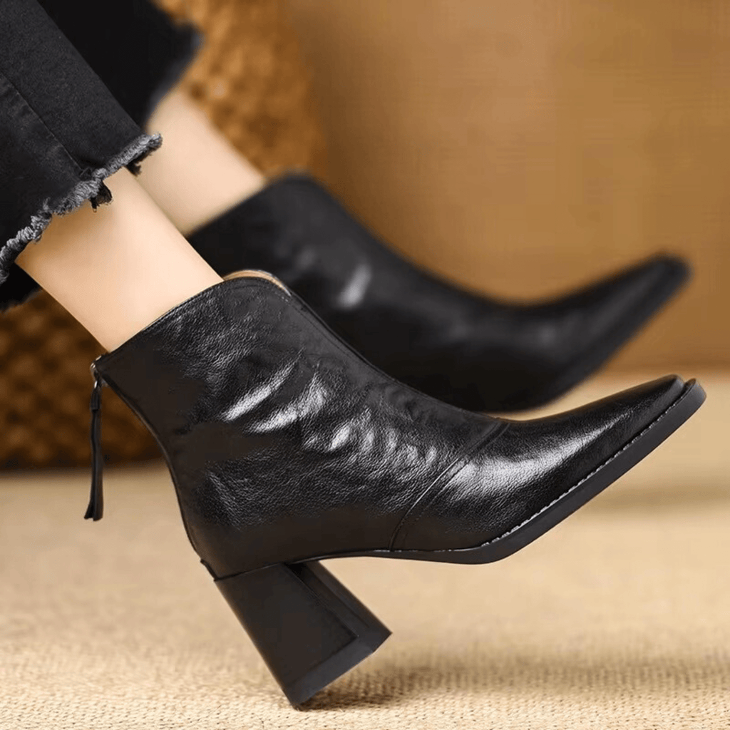 Heeled leather ankle boots — close view of the sole and heel